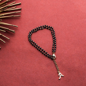 Estele Gold Plated Fascinating "A" Alphabet with Black Beads Bracelet for Women